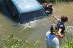 Heroic Bystander's Bold Move Saves Woman from Canal's Deadly Current!