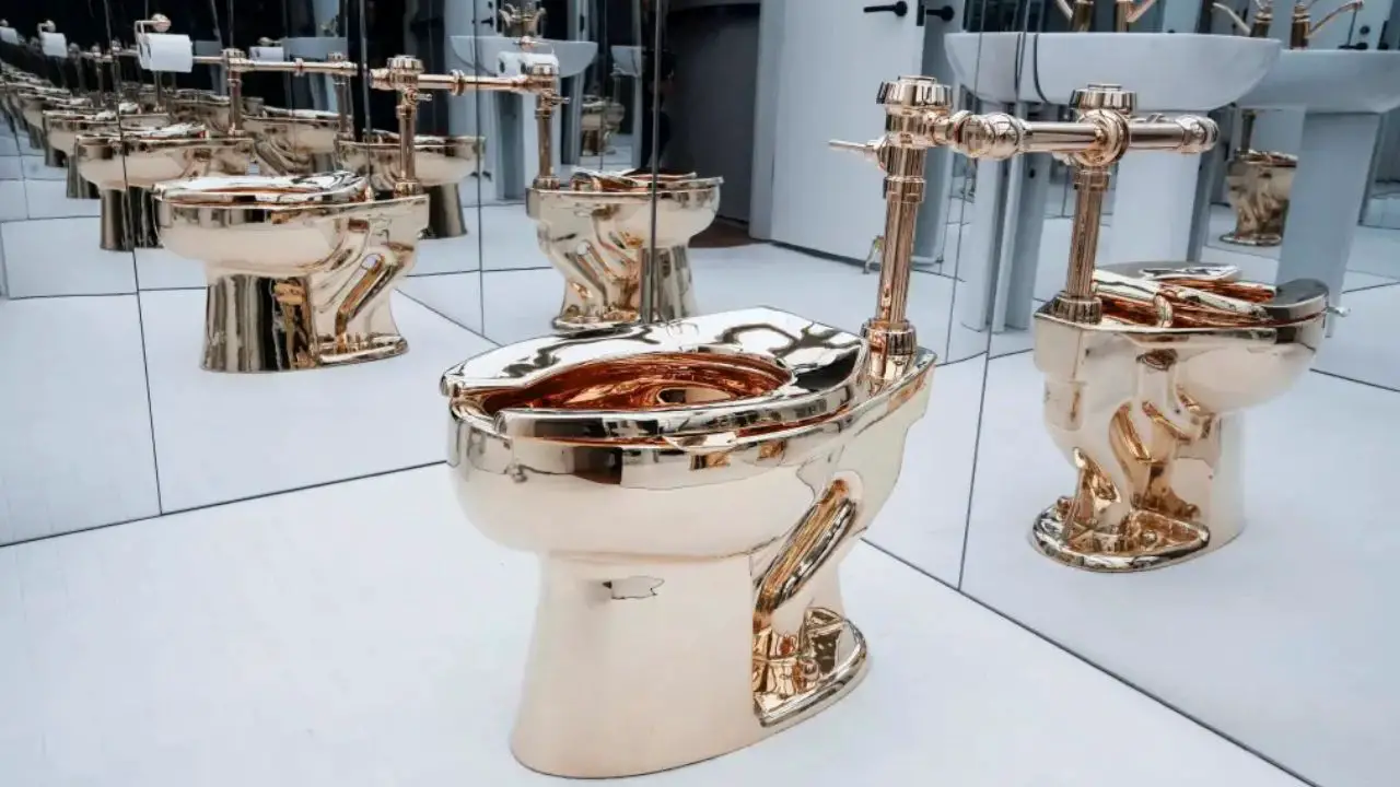 Someone Just Paid $12M for a Working 18-Karat Gold Toilet at Sotheby’s
